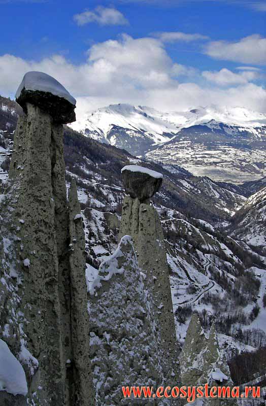 The Earth-pillars - the boulder lying on the top of the moraina sediments column,
that was eroded by the water. The Bern Alps - one of the Western Alps ridges.
Canton Valais, Sion outskirts, Rona river valley